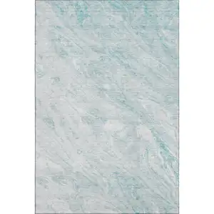 Photo of Teal And Ivory Abstract Washable Area Rug With UV Protection