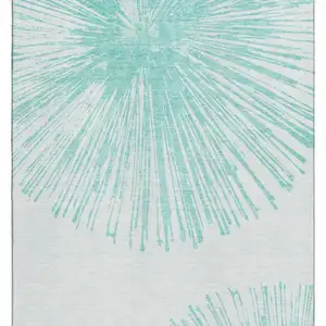 Photo of Teal And Ivory Abstract Washable Area Rug With UV Protection