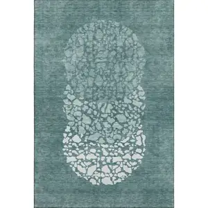 Photo of Teal And Ivory Abstract Washable Area Rug With UV Protection