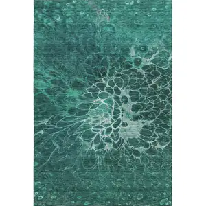 Photo of Teal And Ivory Abstract Washable Area Rug With UV Protection