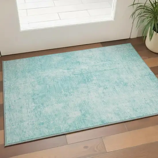 Teal And Ivory Abstract Washable Area Rug With UV Protection Photo 2