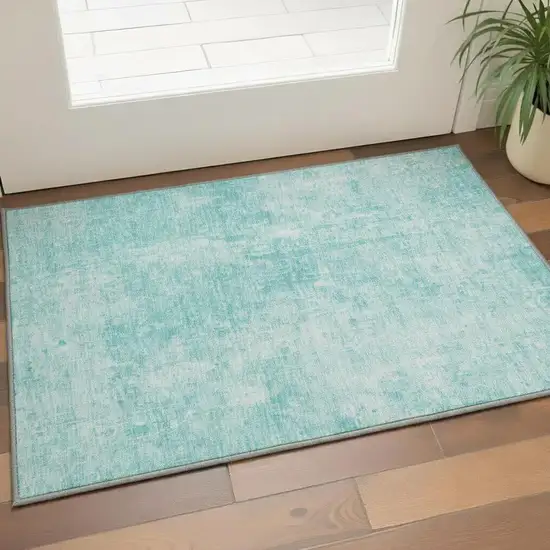 Teal And Ivory Abstract Washable Area Rug With UV Protection Photo 3