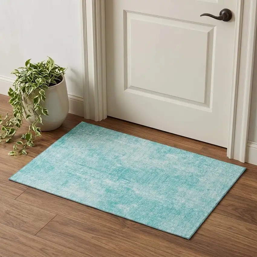 Teal And Ivory Abstract Washable Area Rug With UV Protection Photo 1