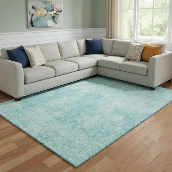 Teal And Ivory Abstract Washable Area Rug With UV Protection Photo 1