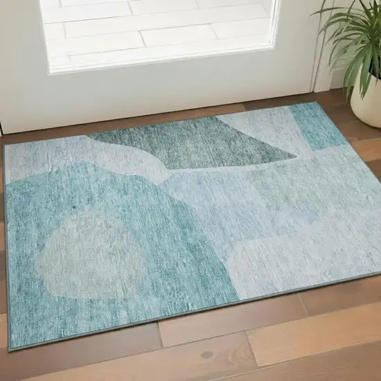 Teal And Ivory Abstract Washable Area Rug With UV Protection Photo 1