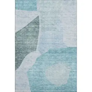 Photo of Teal And Ivory Abstract Washable Area Rug With UV Protection
