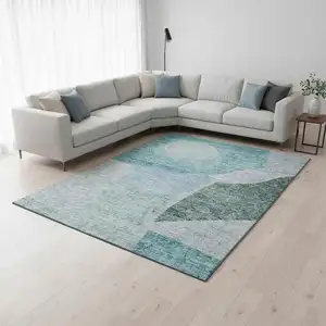 Photo of Teal And Ivory Abstract Washable Area Rug With UV Protection