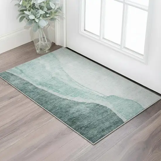 Teal And Ivory Abstract Washable Area Rug With UV Protection Photo 2