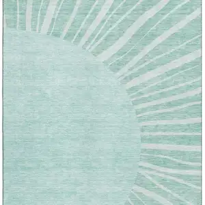 Photo of Teal And Ivory Abstract Washable Area Rug With UV Protection