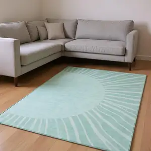 Photo of Teal And Ivory Abstract Washable Area Rug With UV Protection