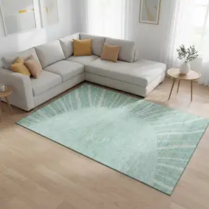 Photo of Teal And Ivory Abstract Washable Area Rug With UV Protection
