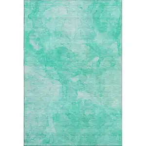 Photo of Teal And Ivory Abstract Washable Area Rug With UV Protection