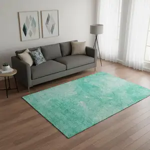 Photo of Teal And Ivory Abstract Washable Area Rug With UV Protection