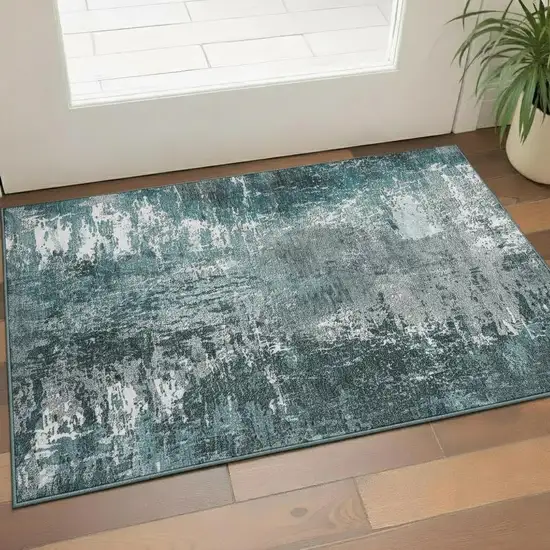 Teal And Ivory Abstract Washable Area Rug With UV Protection Photo 1