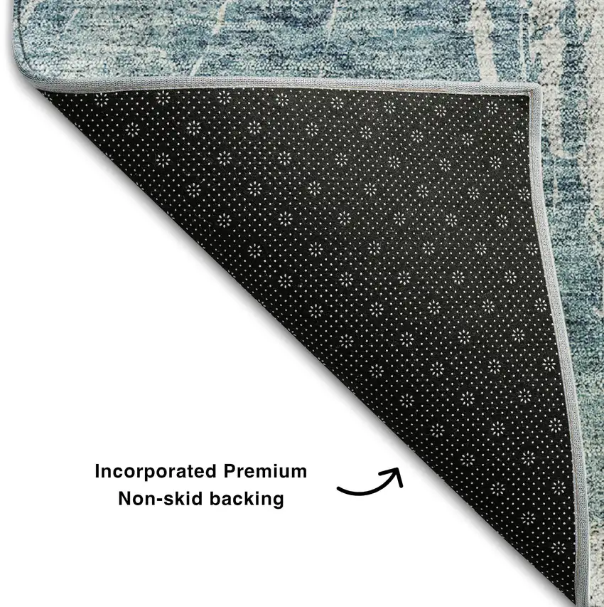 Teal And Ivory Abstract Washable Area Rug With UV Protection Photo 6