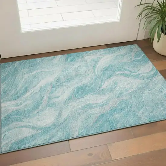 Teal And Ivory Abstract Washable Area Rug With UV Protection Photo 1