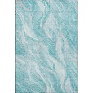 Photo of Teal And Ivory Abstract Washable Area Rug With UV Protection