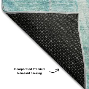 Photo of Teal And Ivory Abstract Washable Area Rug With UV Protection