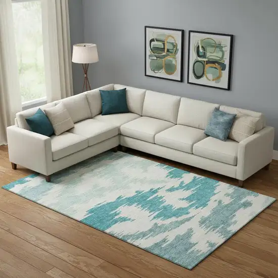 Teal And Ivory Abstract Washable Area Rug With UV Protection Photo 1
