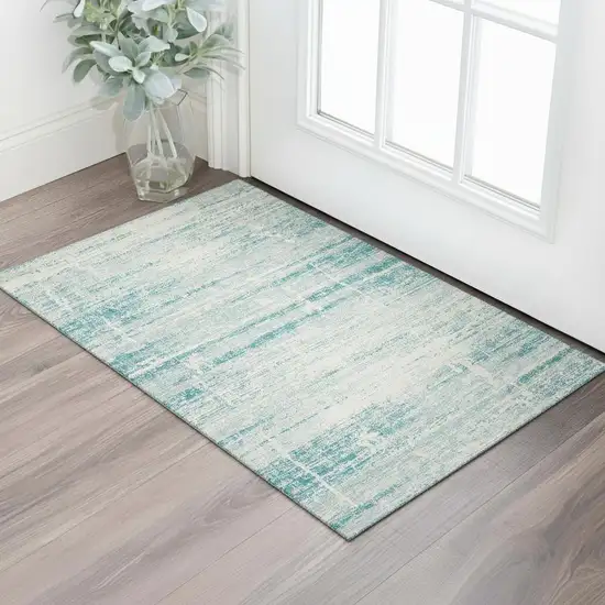 Teal And Ivory Abstract Washable Area Rug With UV Protection Photo 1