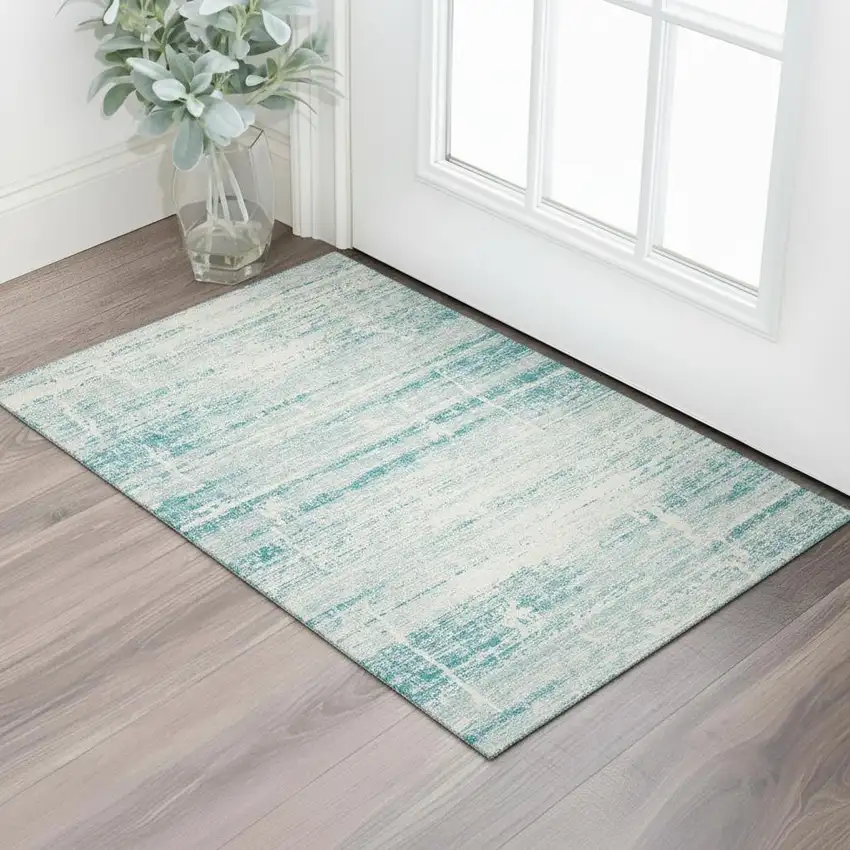 Teal And Ivory Abstract Washable Area Rug With UV Protection Photo 1