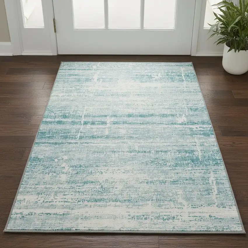 Teal And Ivory Abstract Washable Area Rug With UV Protection Photo 2