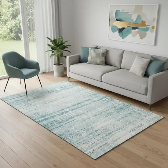 Teal And Ivory Abstract Washable Area Rug With UV Protection Photo 1