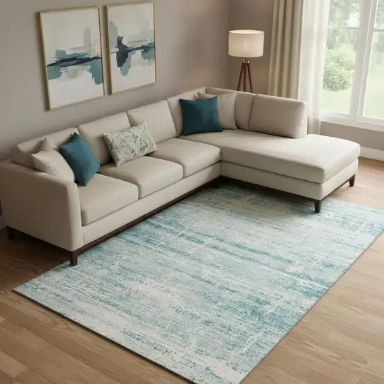 Teal And Ivory Abstract Washable Area Rug With UV Protection Photo 1