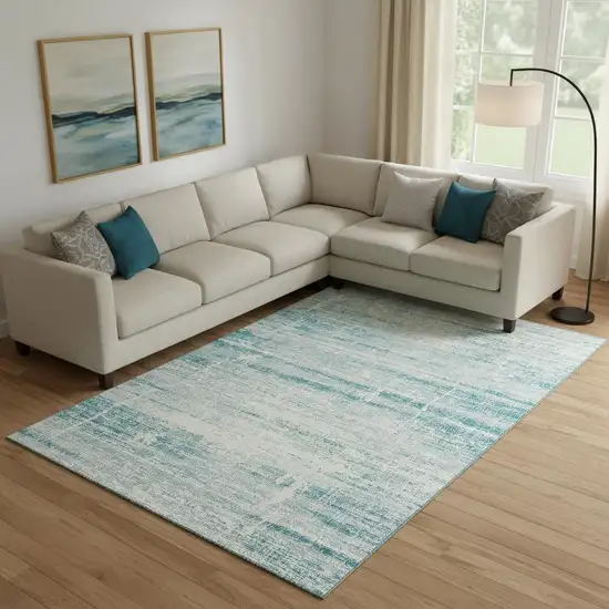 Teal And Ivory Abstract Washable Area Rug With UV Protection Photo 1