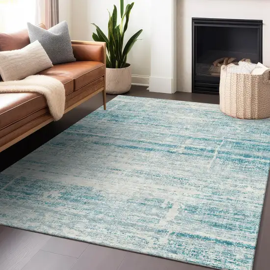 Teal And Ivory Abstract Washable Area Rug With UV Protection Photo 6