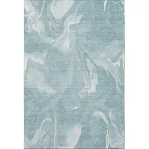 Photo of Teal And Ivory Abstract Washable Area Rug With UV Protection