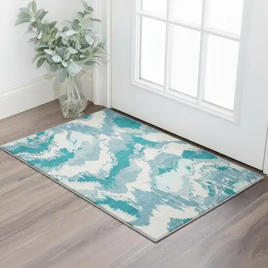 Teal And Ivory Abstract Washable Area Rug With UV Protection Photo 1