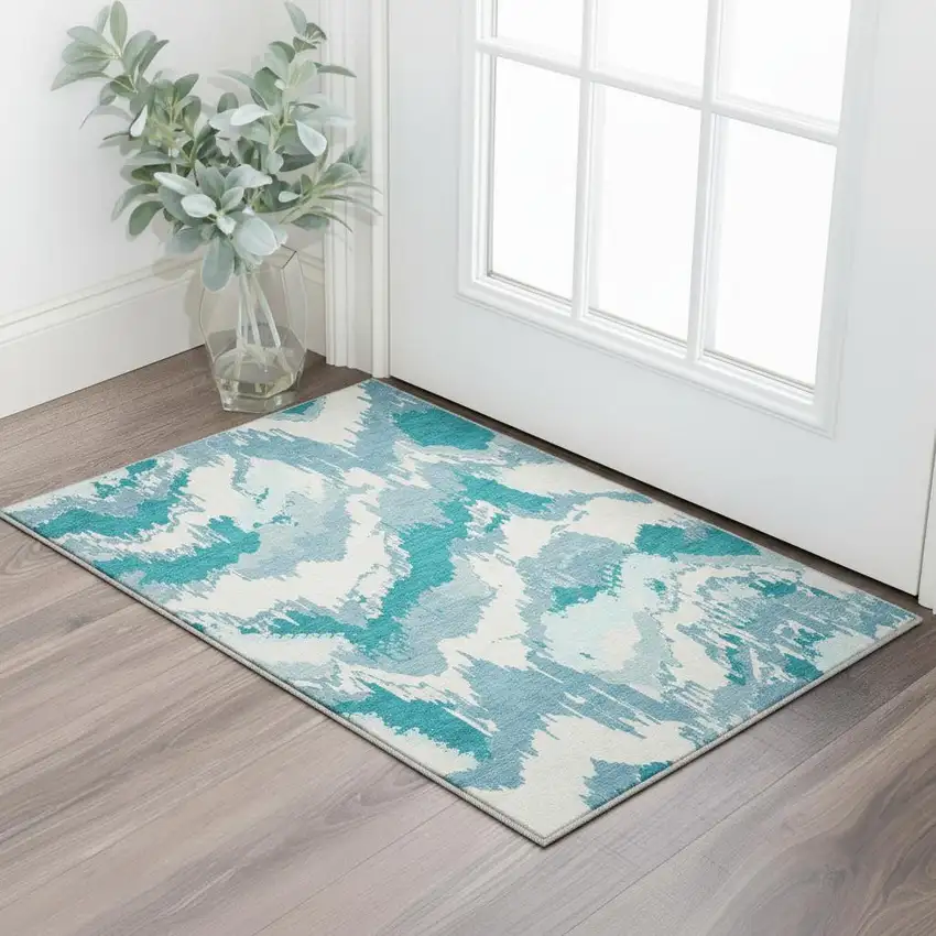 Teal And Ivory Abstract Washable Area Rug With UV Protection Photo 1