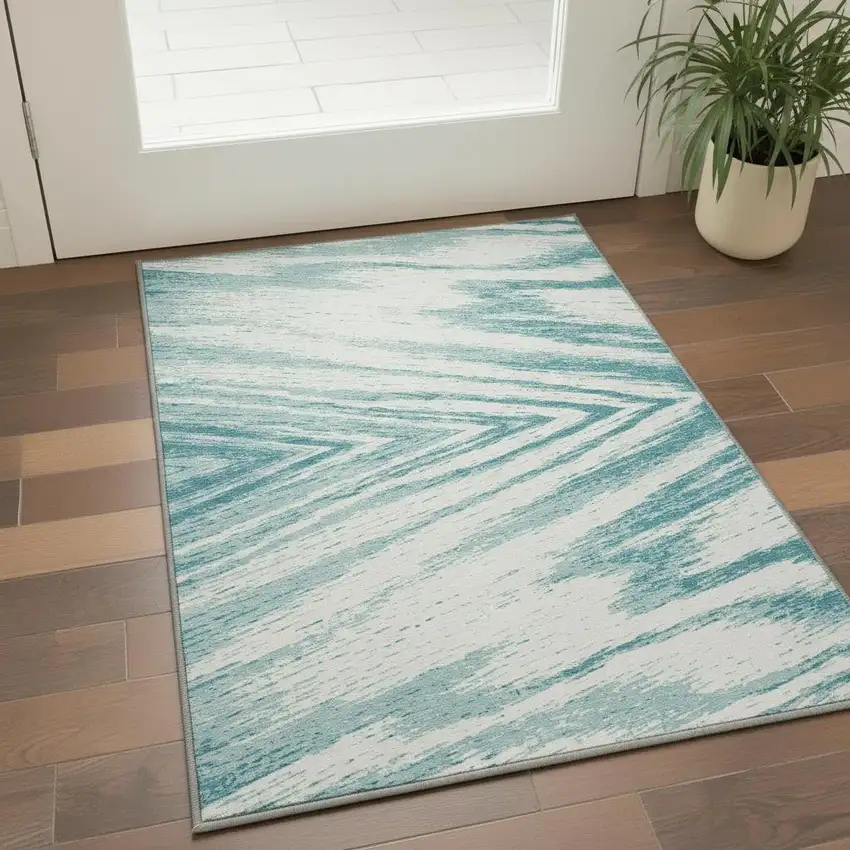 Teal And Ivory Abstract Washable Area Rug With UV Protection Photo 2