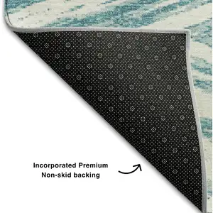 Photo of Teal And Ivory Abstract Washable Area Rug With UV Protection