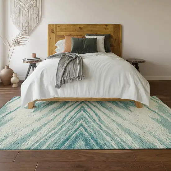 Teal And Ivory Abstract Washable Area Rug With UV Protection Photo 6