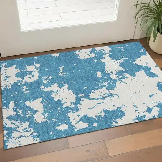 Teal And Ivory Abstract Washable Area Rug With UV Protection Photo 1