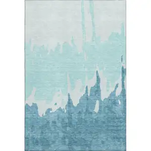 Photo of Teal And Ivory Abstract Washable Area Rug With UV Protection