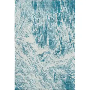 Photo of Teal And Ivory Abstract Washable Area Rug With UV Protection