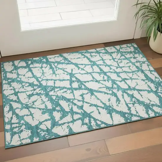 Teal And Ivory Abstract Washable Area Rug With UV Protection Photo 2