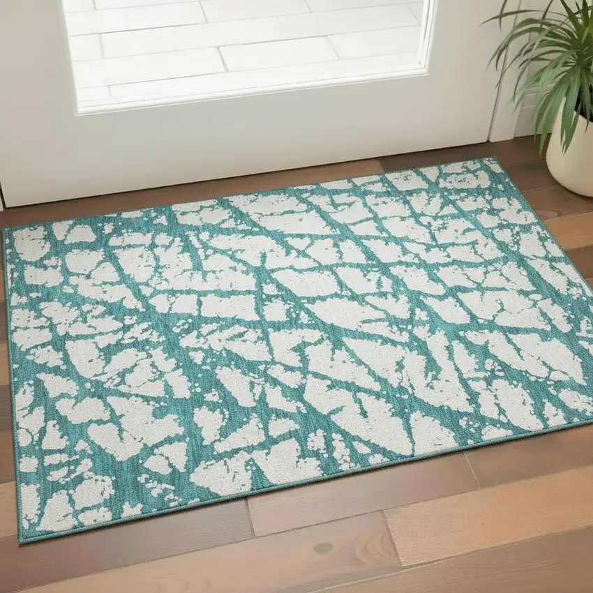 Teal And Ivory Abstract Washable Area Rug With UV Protection Photo 2