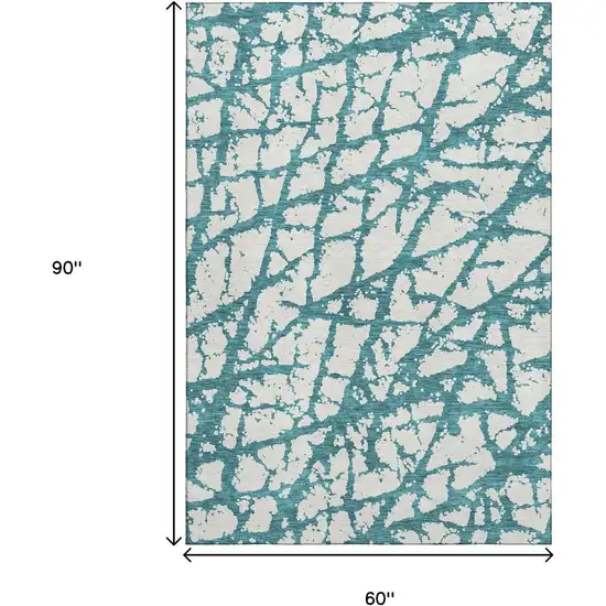 Teal And Ivory Abstract Washable Area Rug With UV Protection Photo 6