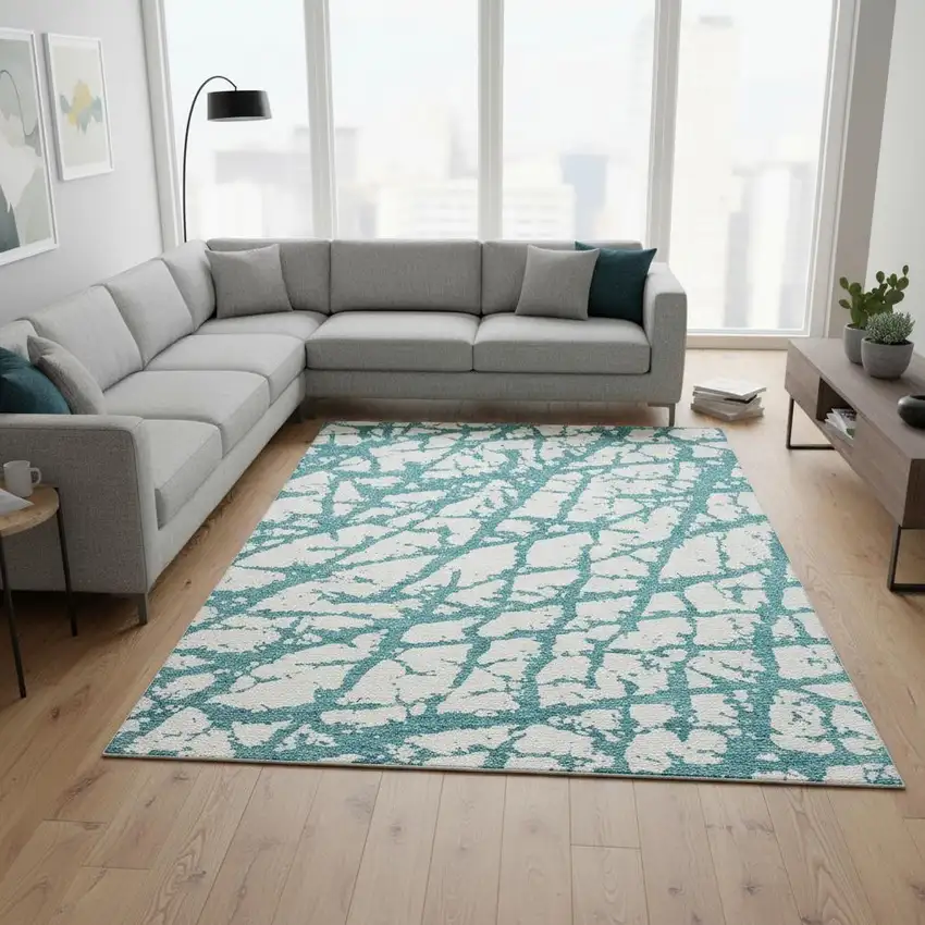 Teal And Ivory Abstract Washable Area Rug With UV Protection Photo 2