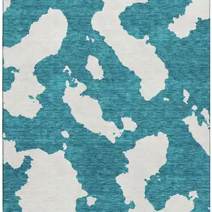 Photo of Teal And Ivory Abstract Washable Area Rug With UV Protection