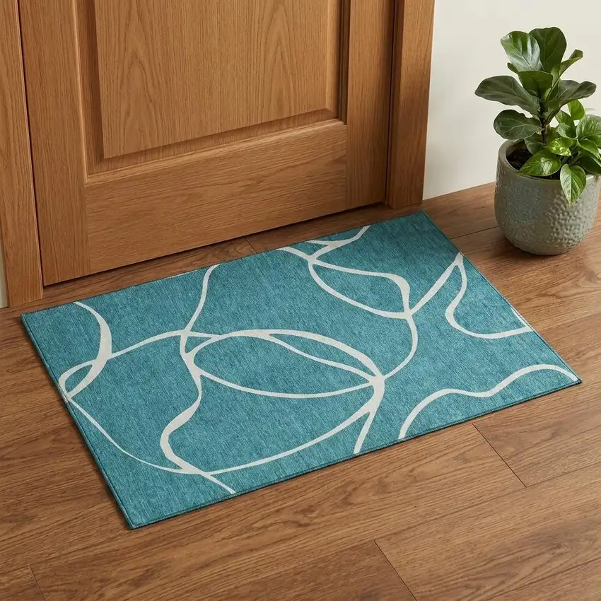 Teal And Ivory Abstract Washable Area Rug With UV Protection Photo 1