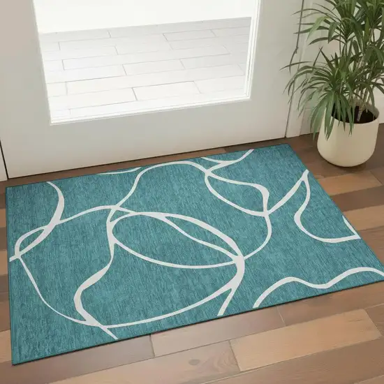 Teal And Ivory Abstract Washable Area Rug With UV Protection Photo 2