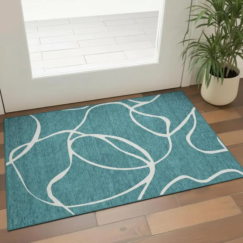 Teal And Ivory Abstract Washable Area Rug With UV Protection Photo 2