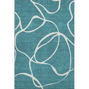 Photo of Teal And Ivory Abstract Washable Area Rug With UV Protection