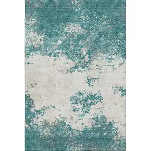 Photo of Teal And Ivory Abstract Washable Area Rug With UV Protection