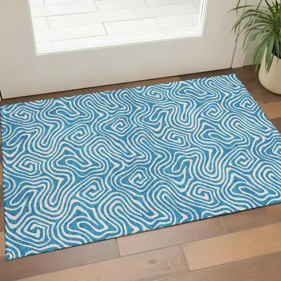 Teal And Ivory Abstract Washable Area Rug With UV Protection Photo 1